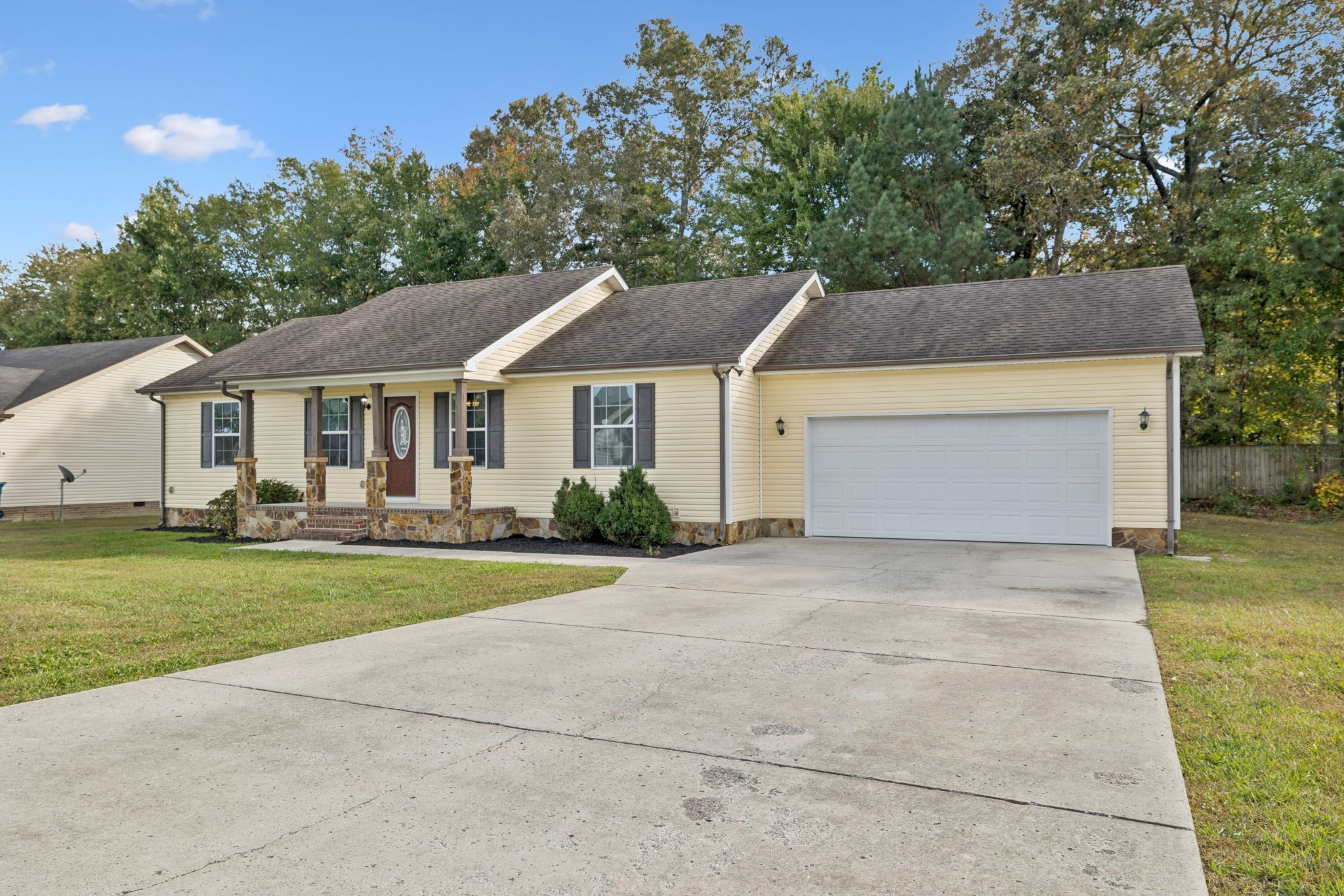538 Indian Springs Circle Manchester, TN 37355 - Photo 1 of 59 a front view of a house with a yard and trees