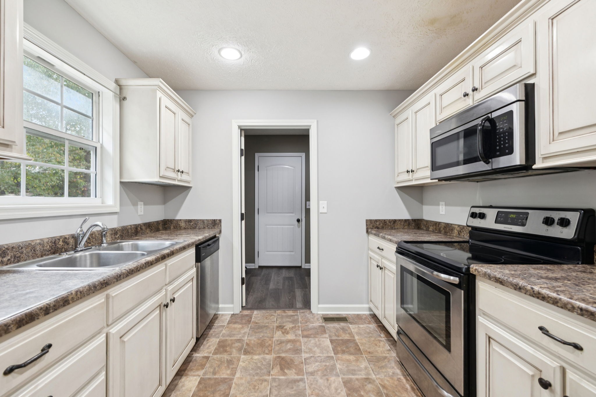 538 Indian Springs Circle Manchester, TN 37355 - Photo 11 of 59 a kitchen with stainless steel appliances granite countertop a stove a sink and a microwave