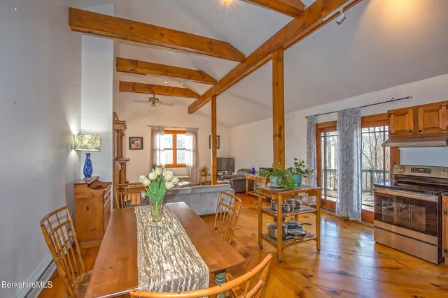 a living room with furniture fireplace and flat screen tv