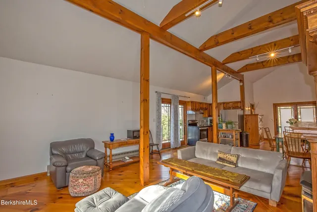 a metallic refrigerator freezer sitting in a kitchen