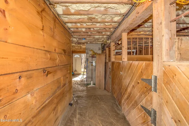 a view of balcony with wooden floor and fence