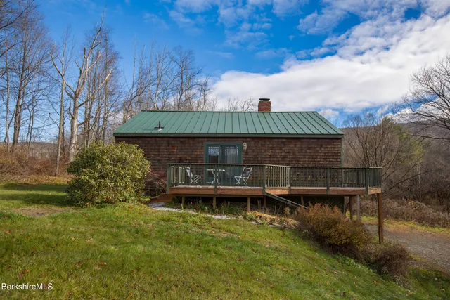a bird view of a house with a yard