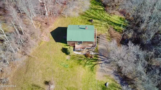 a view of a livingroom with furniture and window