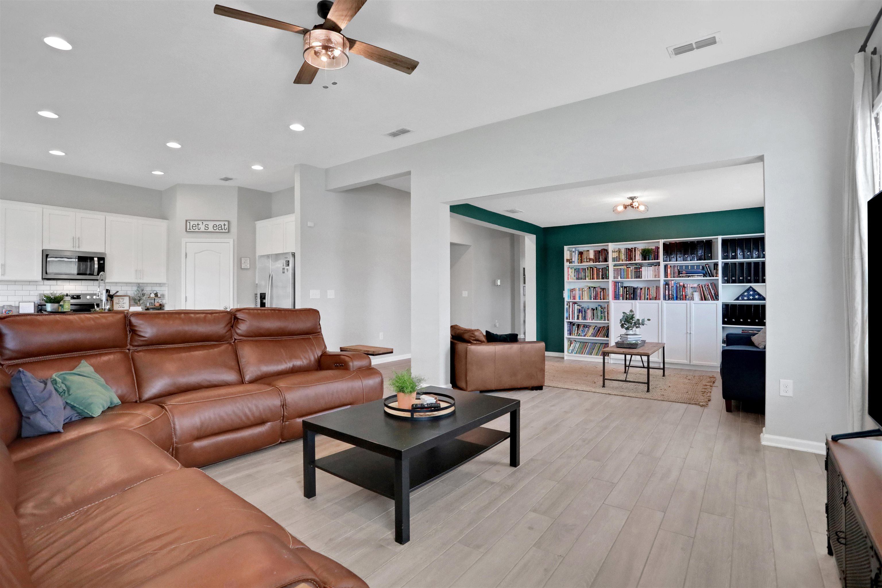 123 Hickory Ridge Road St. Augustine, FL 32084 - Photo 7 of 26 a living room with furniture and wooden floor