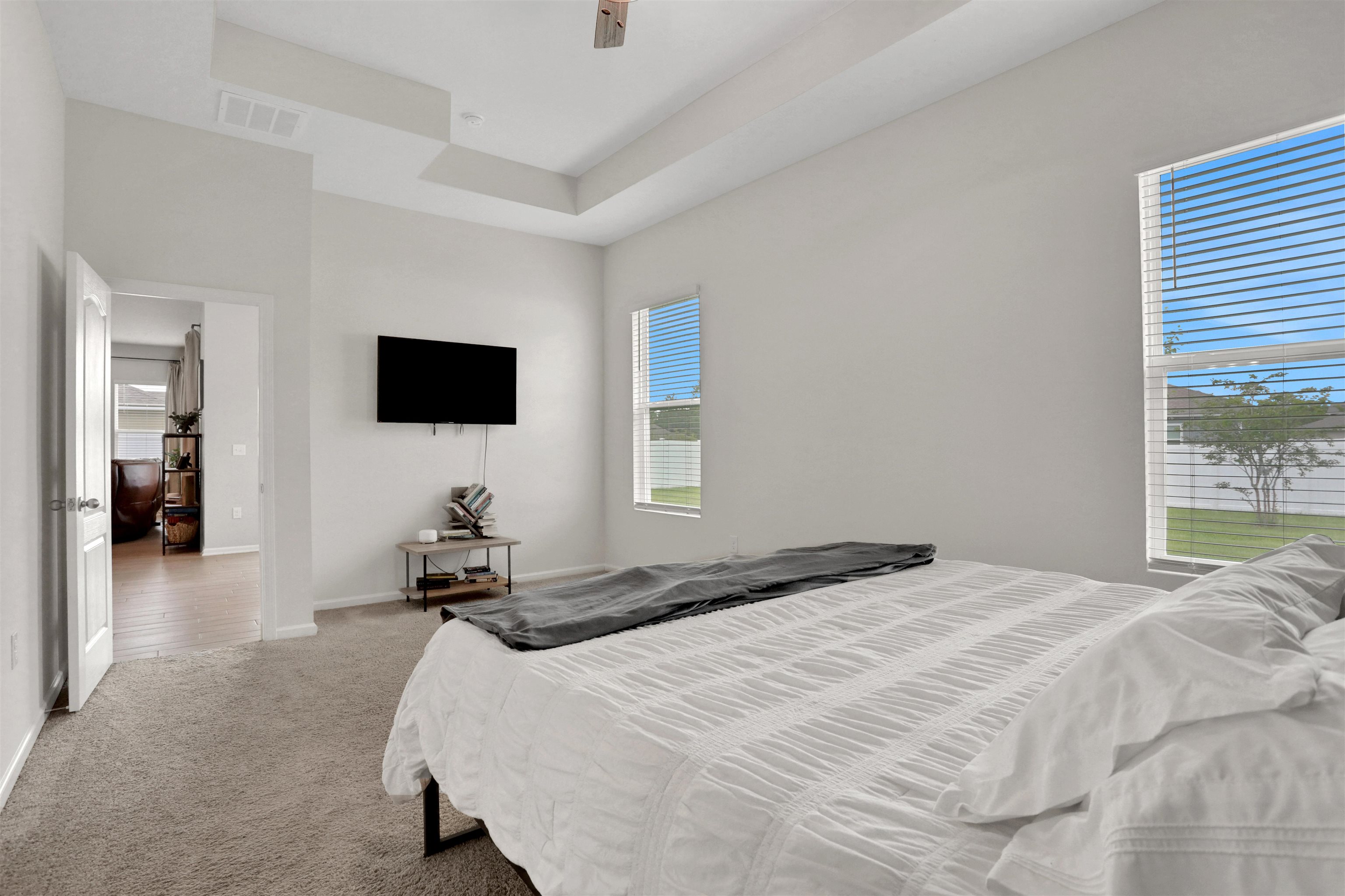 123 Hickory Ridge Road St. Augustine, FL 32084 - Photo 10 of 26 a bedroom with a bed and a flat tv screen on the dresser