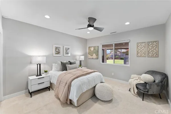 a spacious bedroom with a large bed and a window