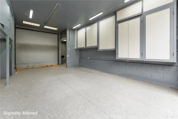 an empty room with large windows