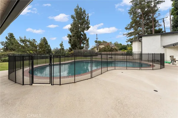 a view of swimming pool with a balcony
