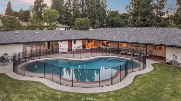 an aerial view of houses with outdoor space