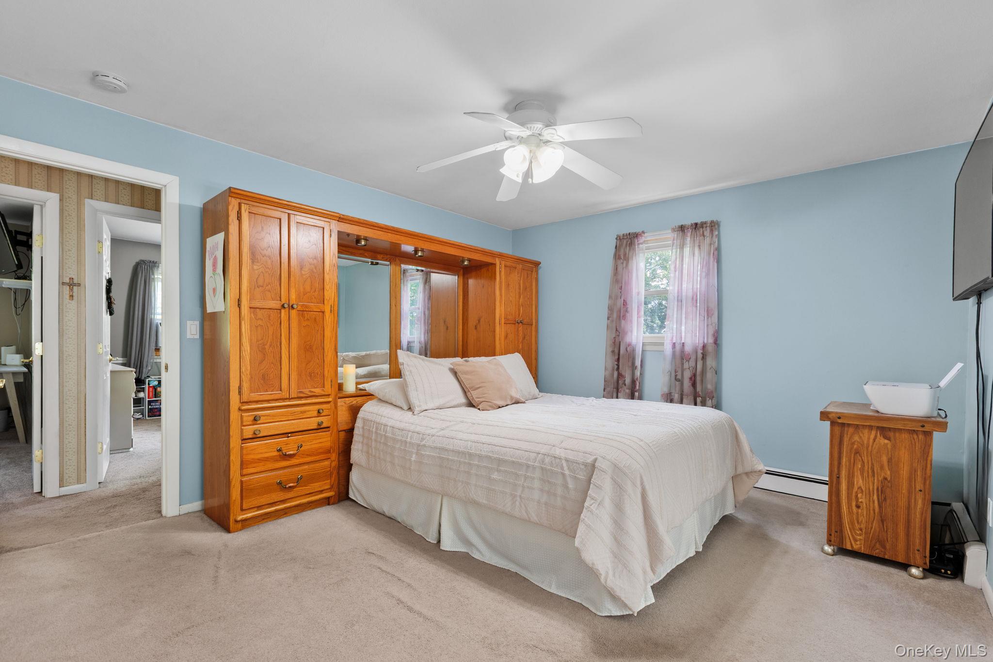 25 Harmony Road Brewster, NY 10509 - Photo 22 of 42 Queen size bed with a bedroom frame equipped with extra storage space.