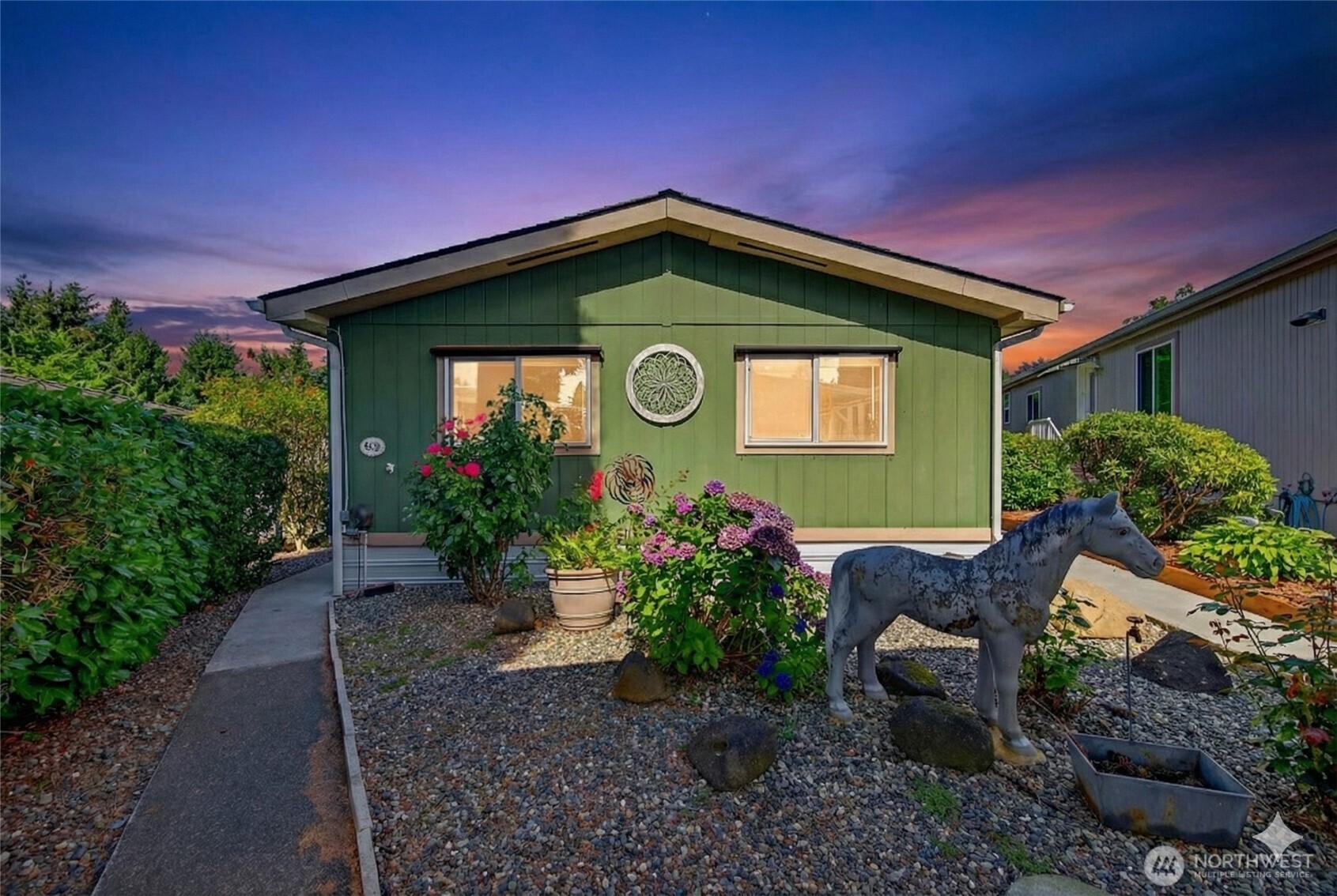 a front view of a house with garden