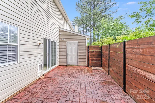 a view of a backyard of the house