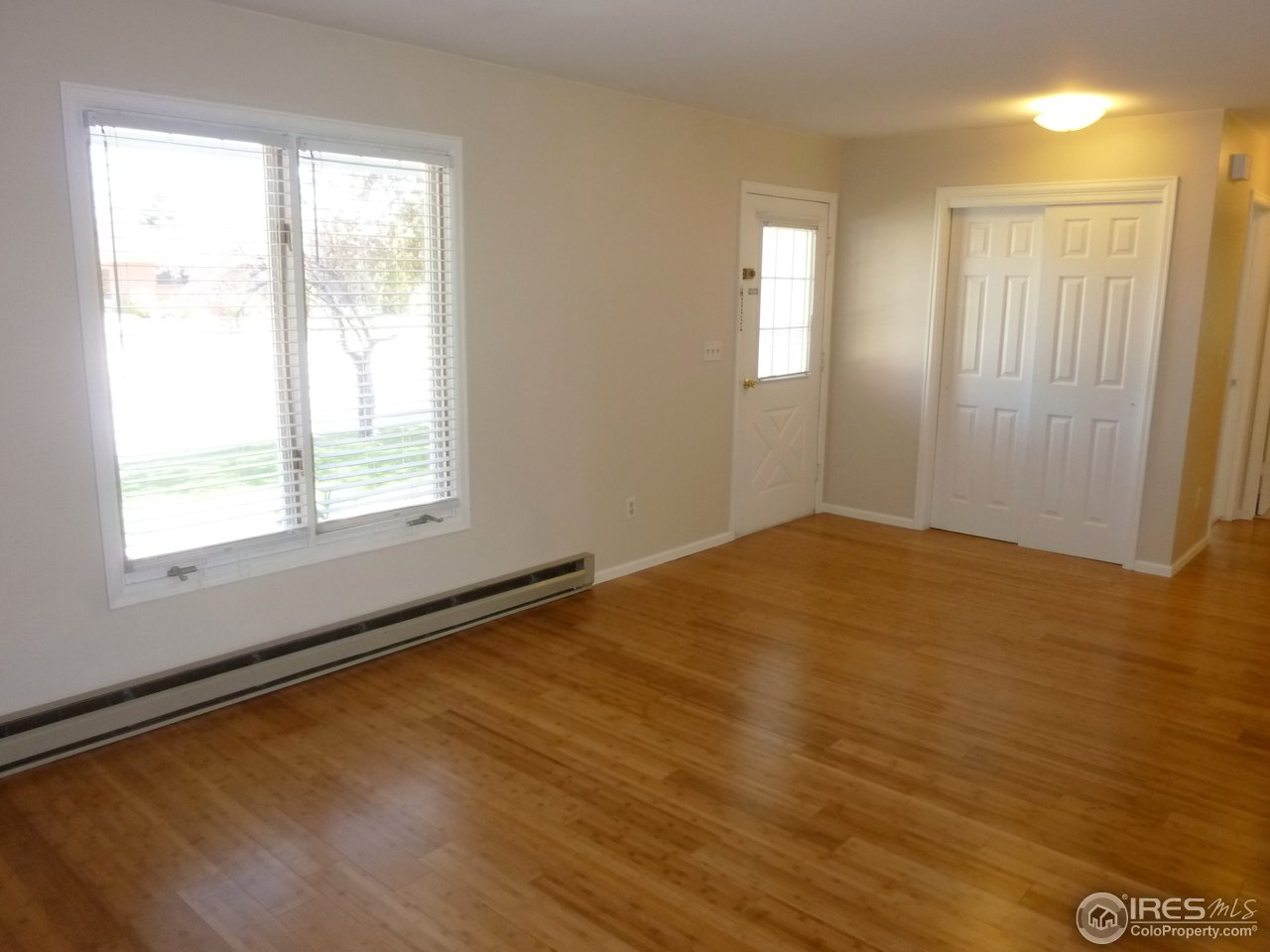 1305 Centennial Road Fort Collins, CO 80525 - Photo 5 of 25 Large windows and gorgeous hardwood flooring