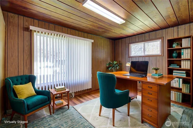 a workspace with furniture and a bookshelf