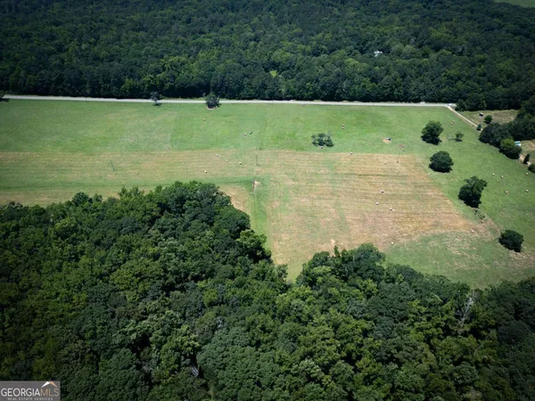 a view of a lake with a yard