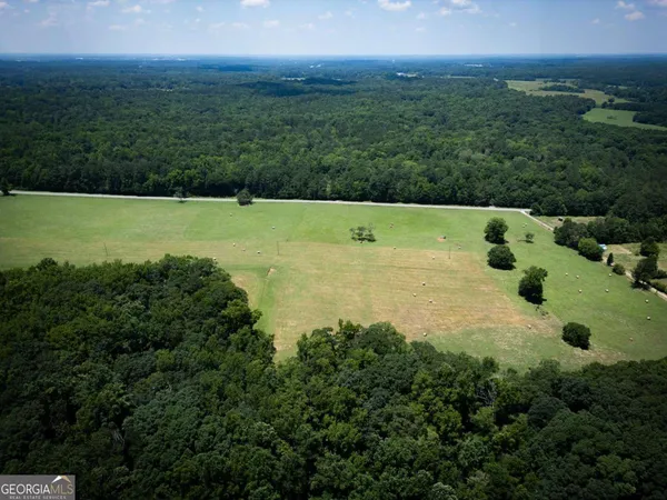 an aerial view of residential house with outdoor space