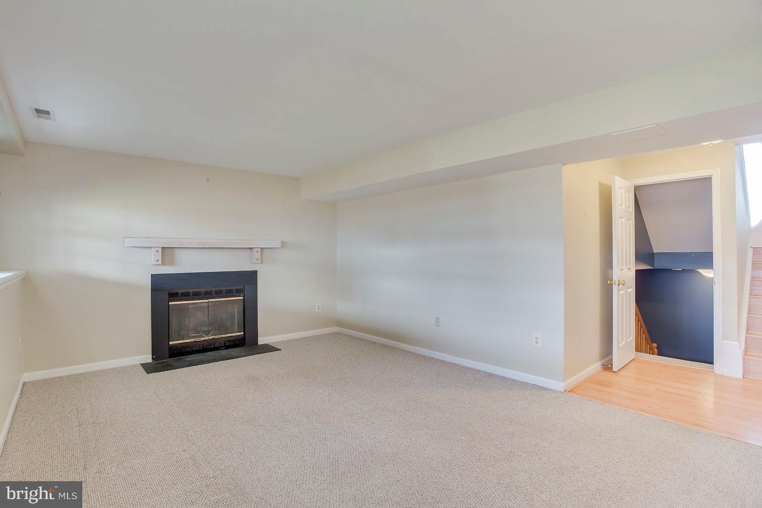 4502 Sandwood Road Baltimore, MD 21219 - Photo 33 of 39 family room wood burning fireplace