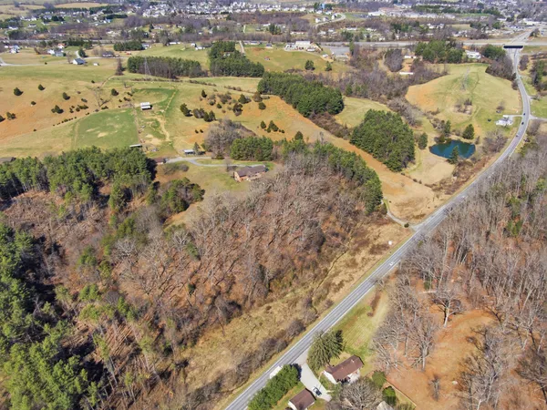an aerial view of a residential houses with outdoor space