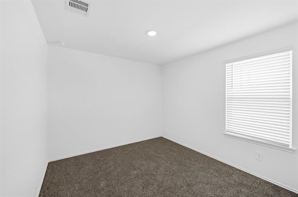 31006 Brightwell Bend Fulshear, TX 77441 - Photo 18 of 47 an empty room with a window