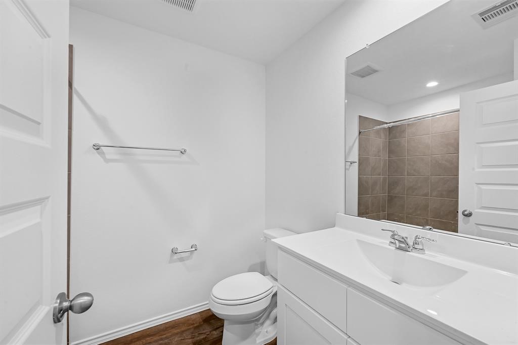 31006 Brightwell Bend Fulshear, TX 77441 - Photo 19 of 47 a bathroom with a sink toilet and shower
