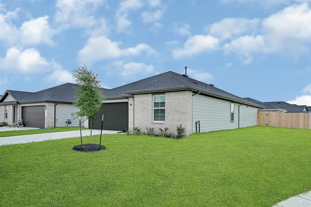 31006 Brightwell Bend Fulshear, TX 77441 - Photo 2 of 47 a view of a house with a yard