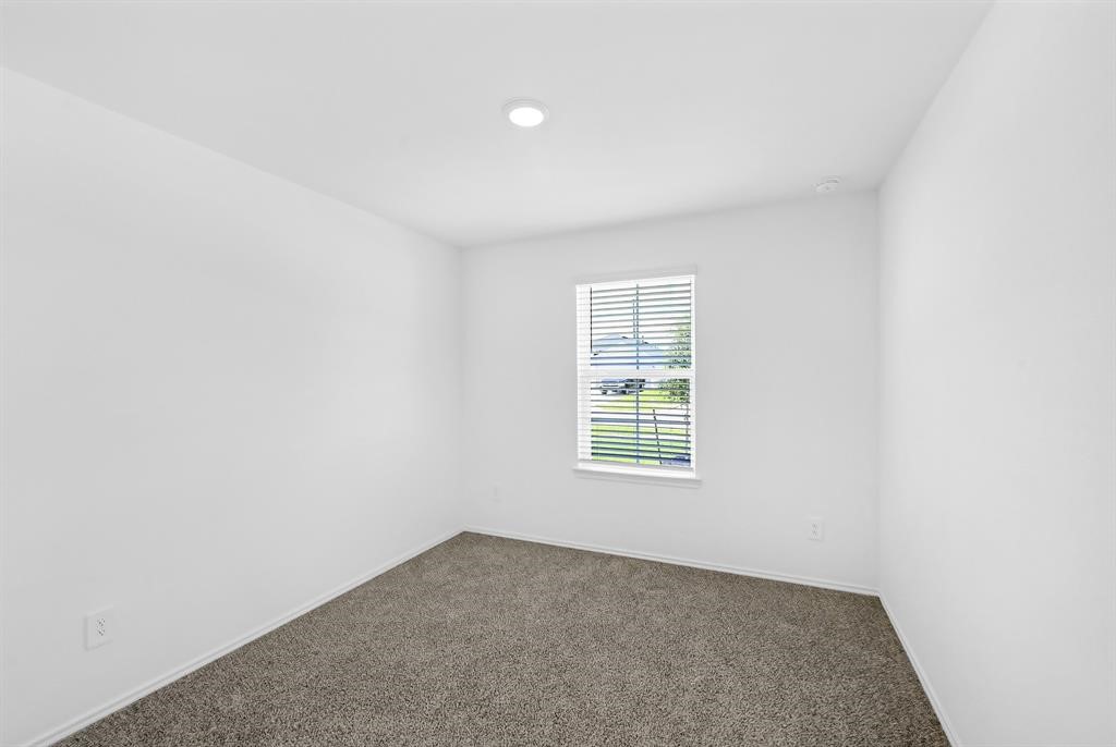 31006 Brightwell Bend Fulshear, TX 77441 - Photo 21 of 47 an empty room with a window