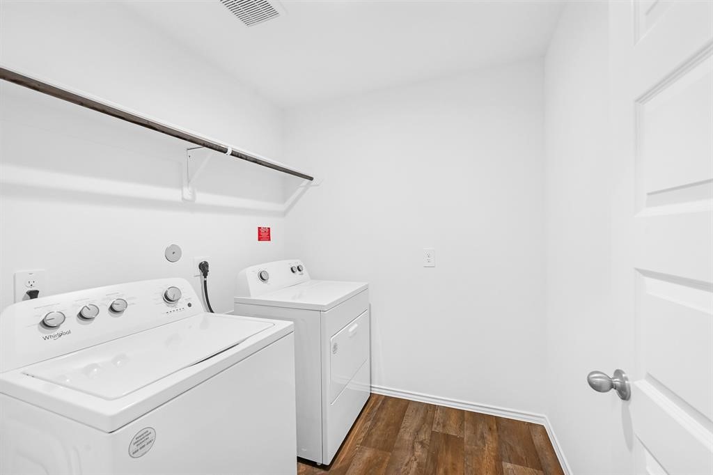 31006 Brightwell Bend Fulshear, TX 77441 - Photo 22 of 47 a utility room with dryer and washer