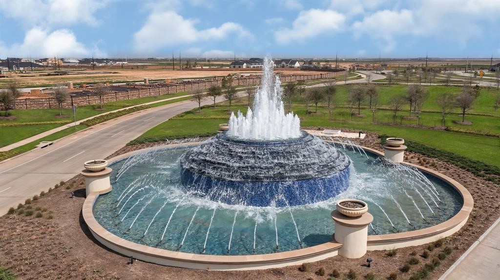 31006 Brightwell Bend Fulshear, TX 77441 - Photo 26 of 47 a view of a water fountain and a lake view