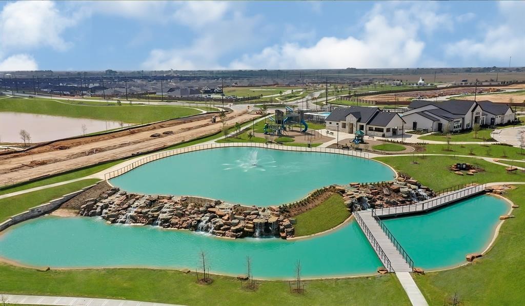31006 Brightwell Bend Fulshear, TX 77441 - Photo 28 of 47 a view of a swimming pool and an outdoor space