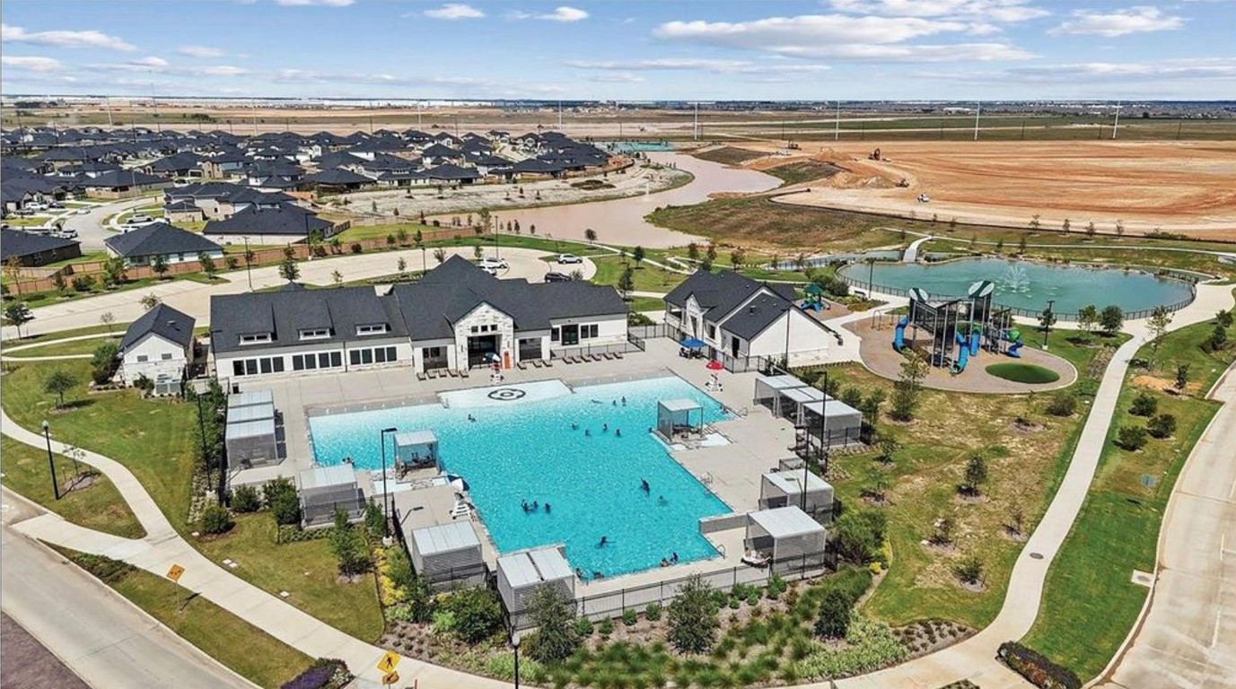 31006 Brightwell Bend Fulshear, TX 77441 - Photo 35 of 47 an aerial view of a city with lots of residential buildings and ocean view
