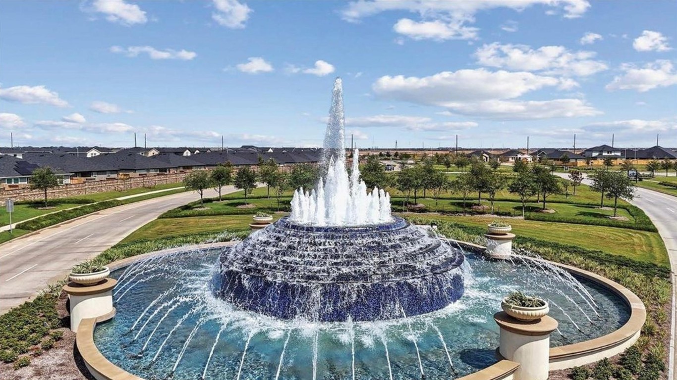 31006 Brightwell Bend Fulshear, TX 77441 - Photo 36 of 47 a view of a swimming pool with a lounge chair