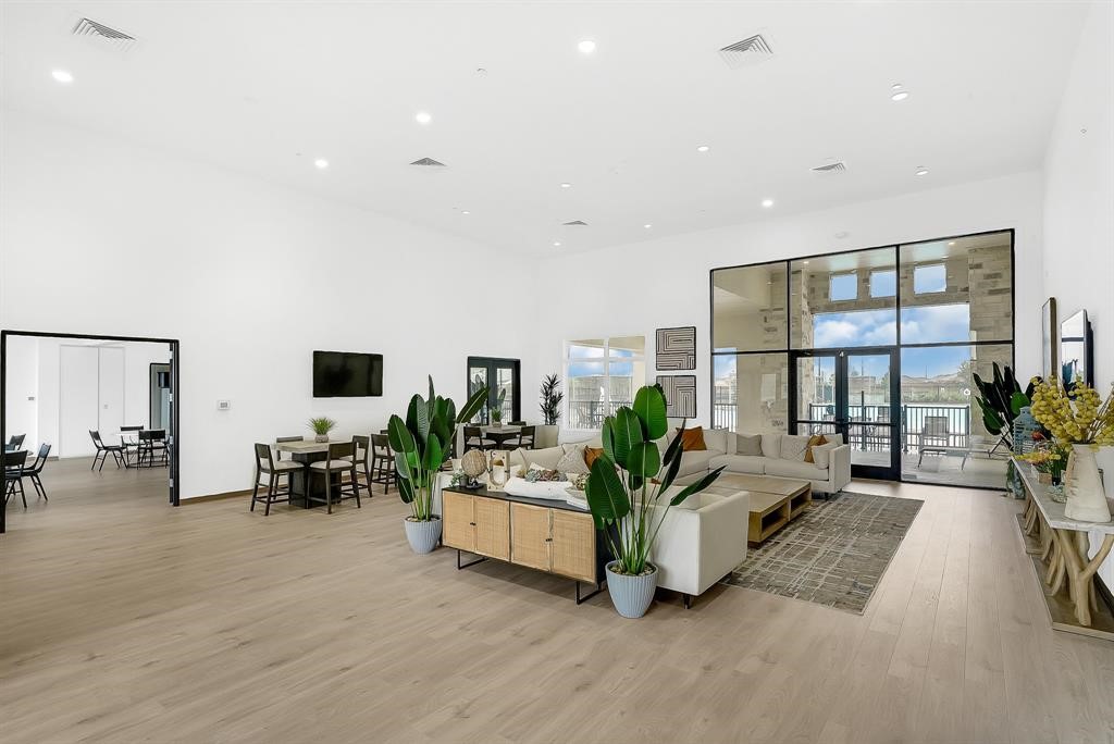 31006 Brightwell Bend Fulshear, TX 77441 - Photo 38 of 47 a living room with furniture and a flat screen tv