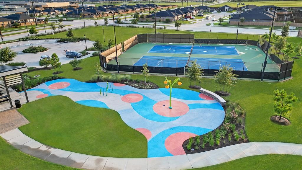 31006 Brightwell Bend Fulshear, TX 77441 - Photo 45 of 47 an aerial view of a pool yard patio and outdoor kitchen