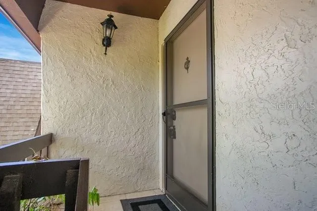 a bathroom with a shower and a sink