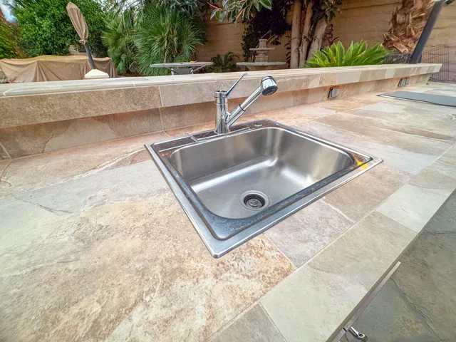 a view of a house with a palm tree