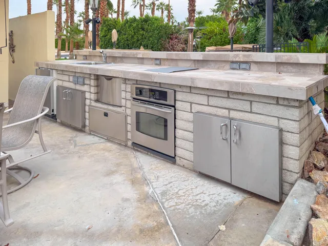a view of a kitchen with sink and dishwasher