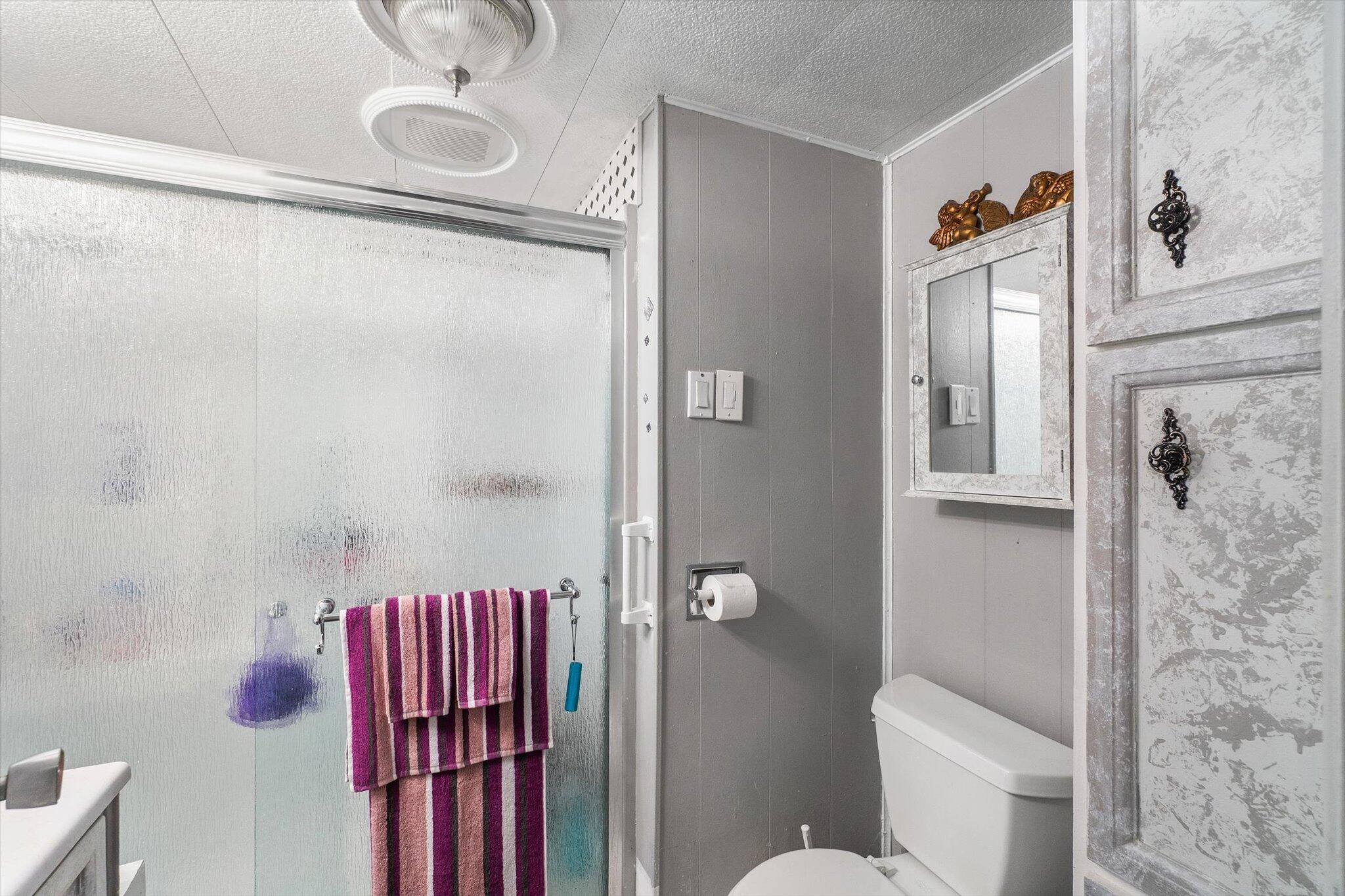 481 Twin View Boulevard, Unit 63 Redding, CA 96003 - Photo 13 of 20 a bathroom with a toilet and shower