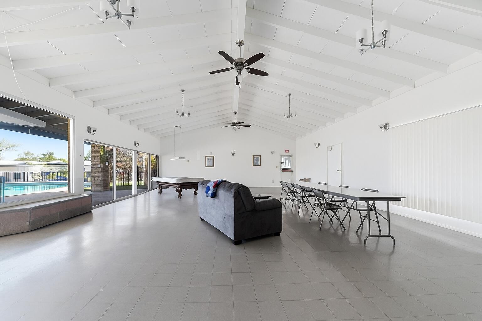 481 Twin View Boulevard, Unit 63 Redding, CA 96003 - Photo 19 of 20 a view of a livingroom with furniture a ceiling fan and window