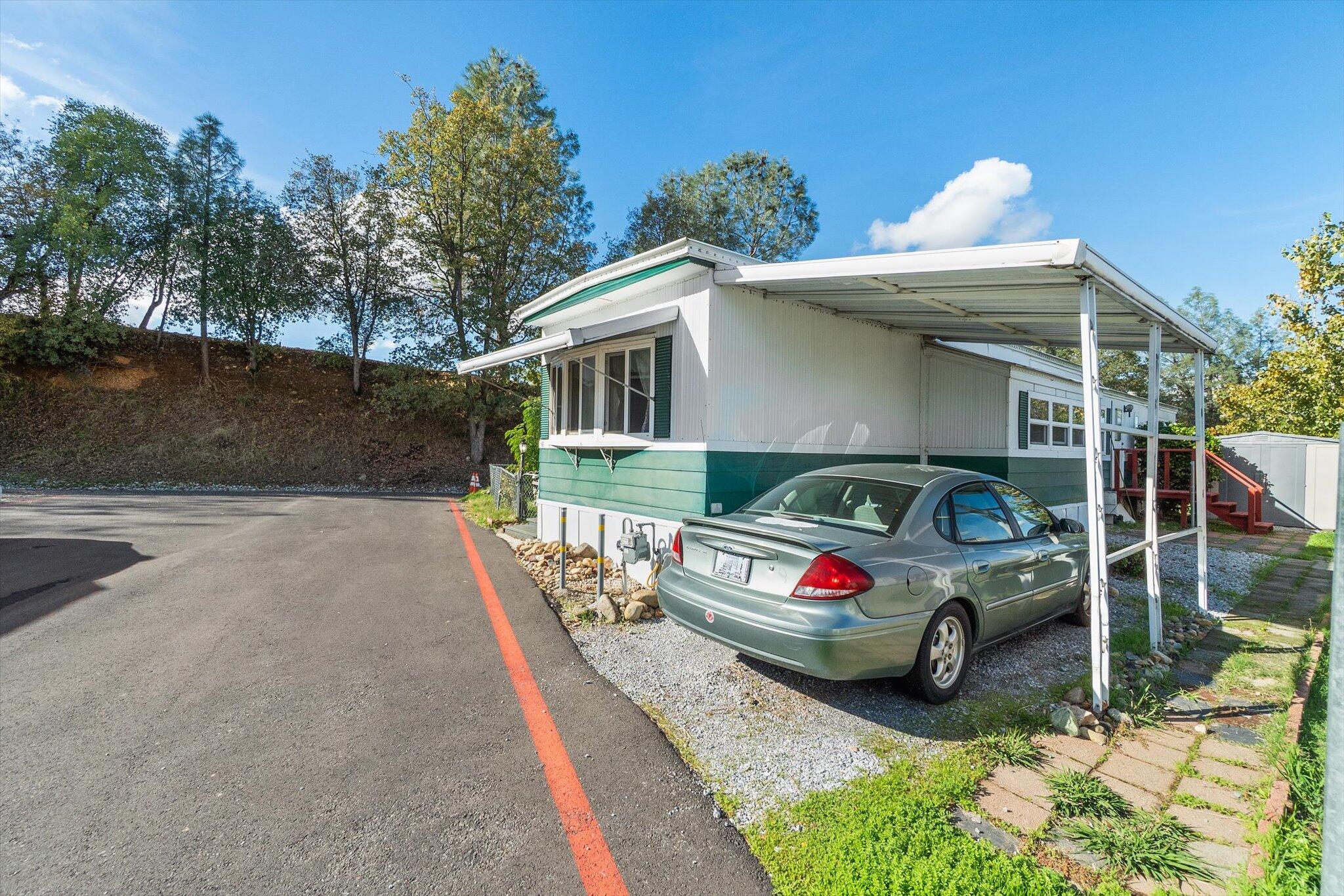 481 Twin View Boulevard, Unit 63 Redding, CA 96003 - Photo 2 of 20 a car parked in front of a house