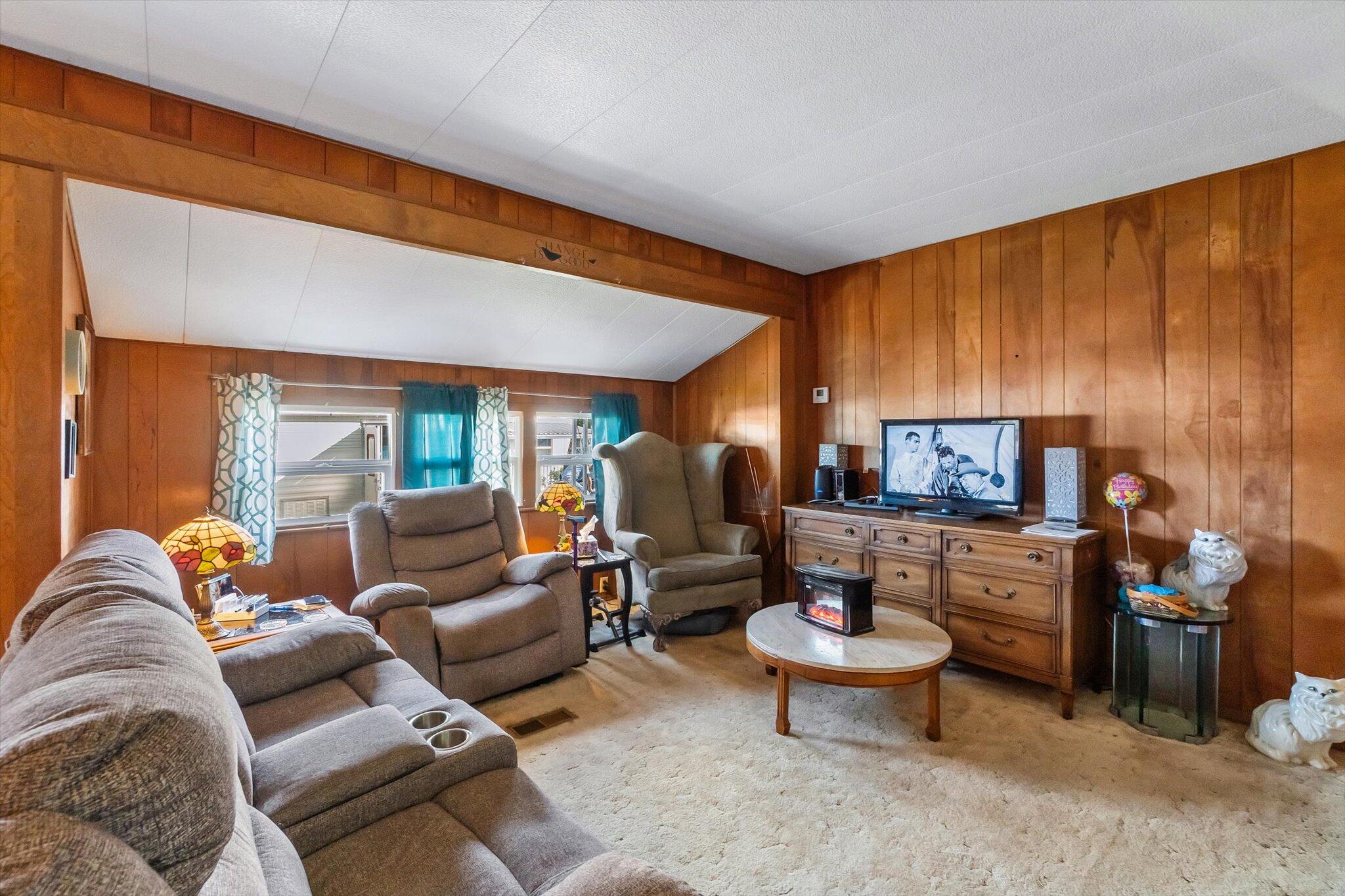 481 Twin View Boulevard, Unit 63 Redding, CA 96003 - Photo 5 of 20 a living room with furniture and a large window
