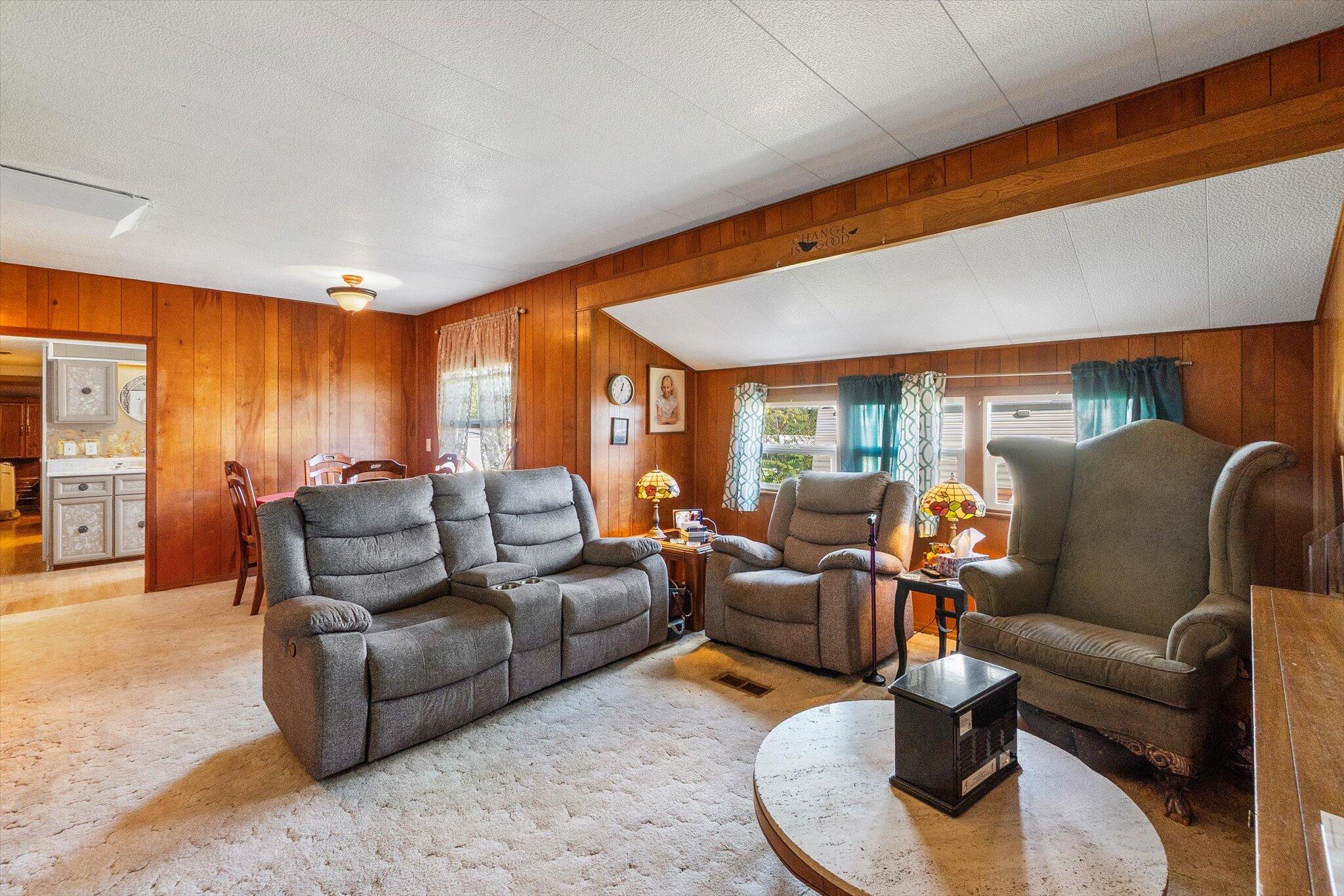 481 Twin View Boulevard, Unit 63 Redding, CA 96003 - Photo 6 of 20 a living room with furniture kitchen view and a large window