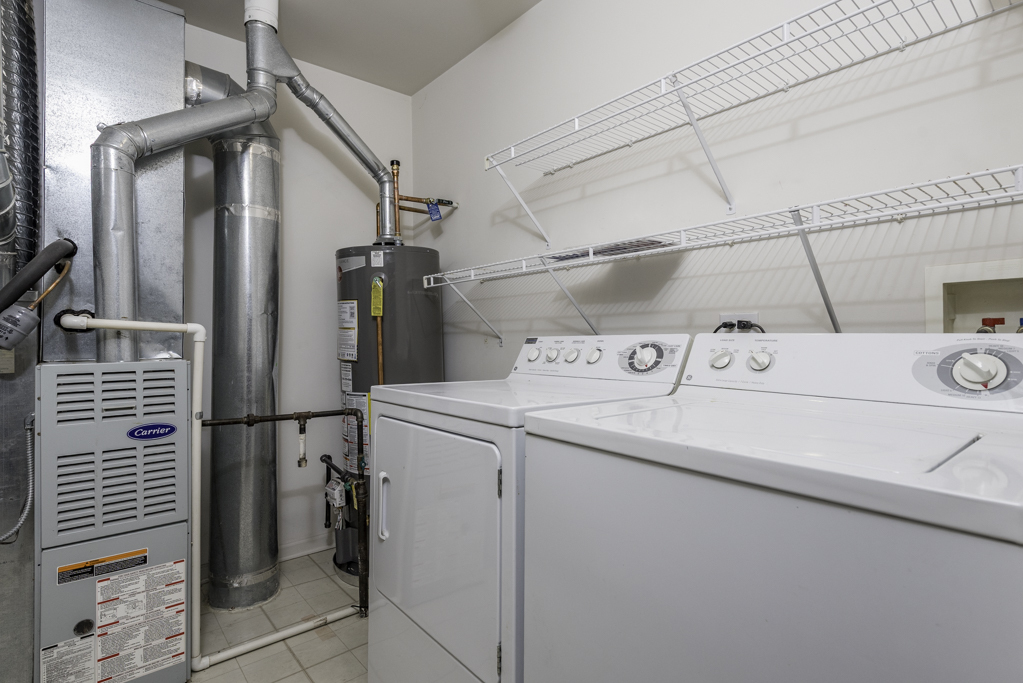 2879 Falling Waters Drive, Unit 2879 Lindenhurst, IL 60046 - Photo 13 of 30 a utility room with dryer and washer