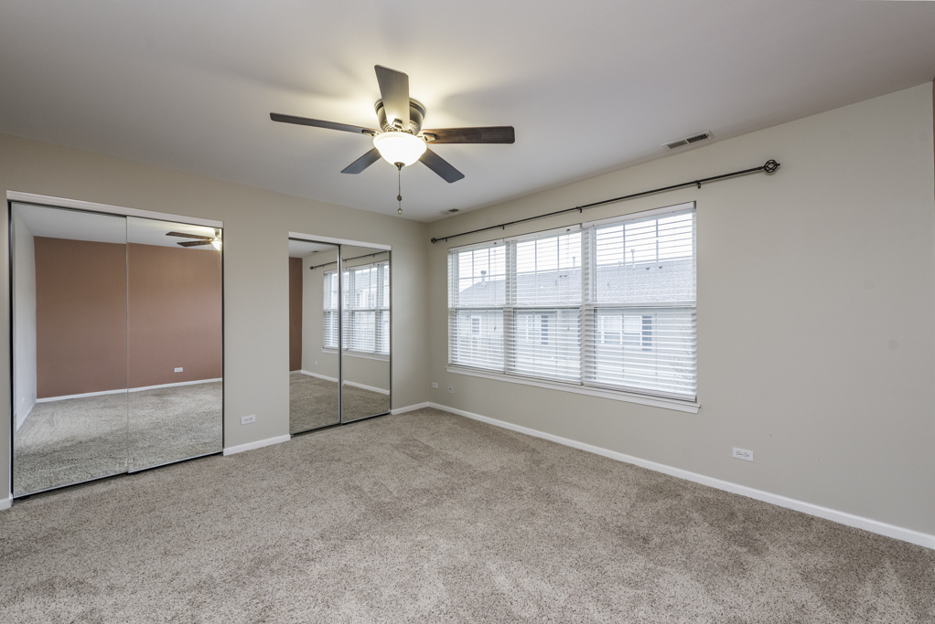 2879 Falling Waters Drive, Unit 2879 Lindenhurst, IL 60046 - Photo 16 of 30 a view of an empty room with a window