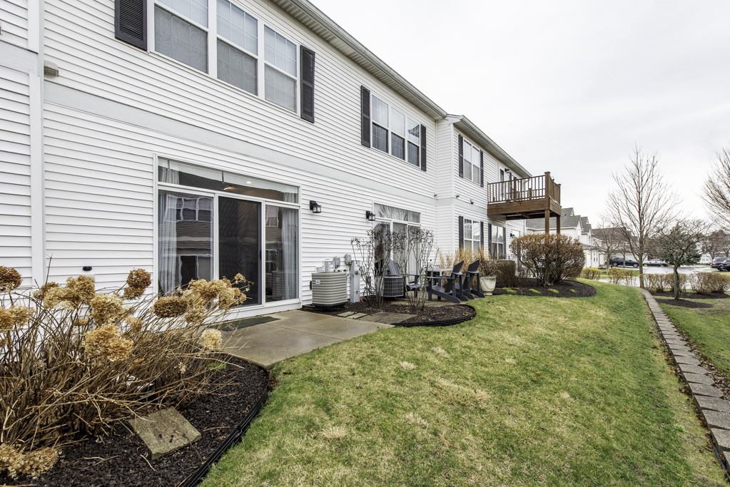 2879 Falling Waters Drive, Unit 2879 Lindenhurst, IL 60046 - Photo 23 of 30 a view of a house with backyard