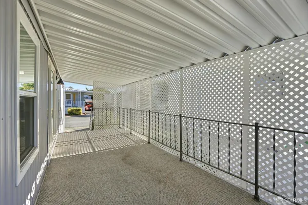 a view of a porch with furniture