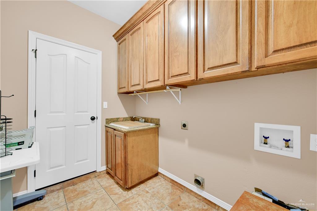 2005 Stuart Road Weslaco, TX 78599 - Photo 19 of 30 a view of cabinets and wooden floor
