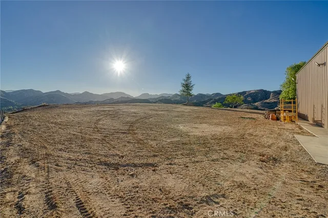 a view of a town with mountains in the background