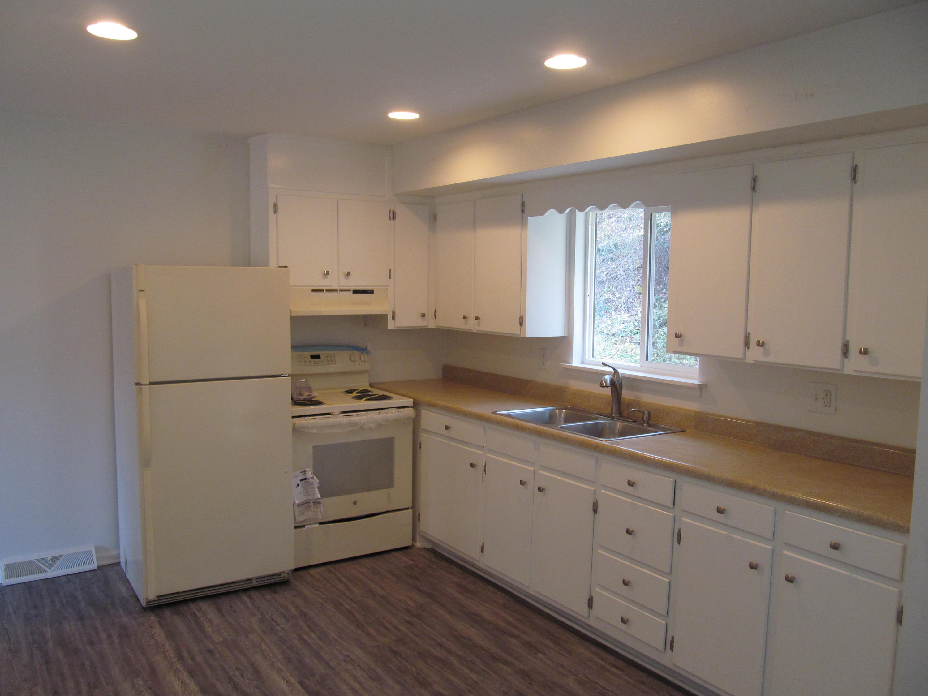 1370 Blue Ridge Springs Road Blue Ridge, VA 24064 - Photo 5 of 20 a kitchen with appliances a sink and a window