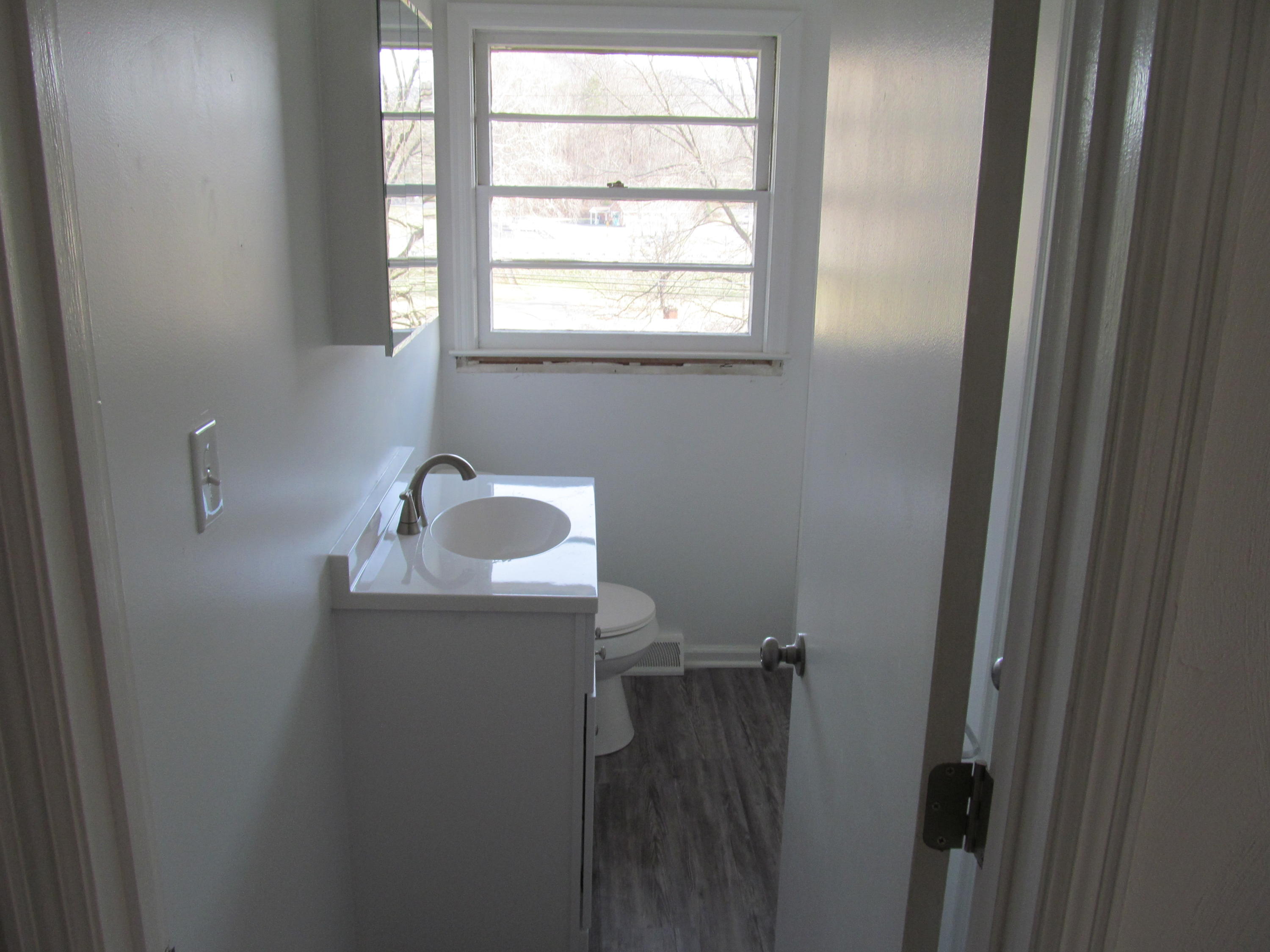1370 Blue Ridge Springs Road Blue Ridge, VA 24064 - Photo 6 of 20 a bathroom with a sink and mirror