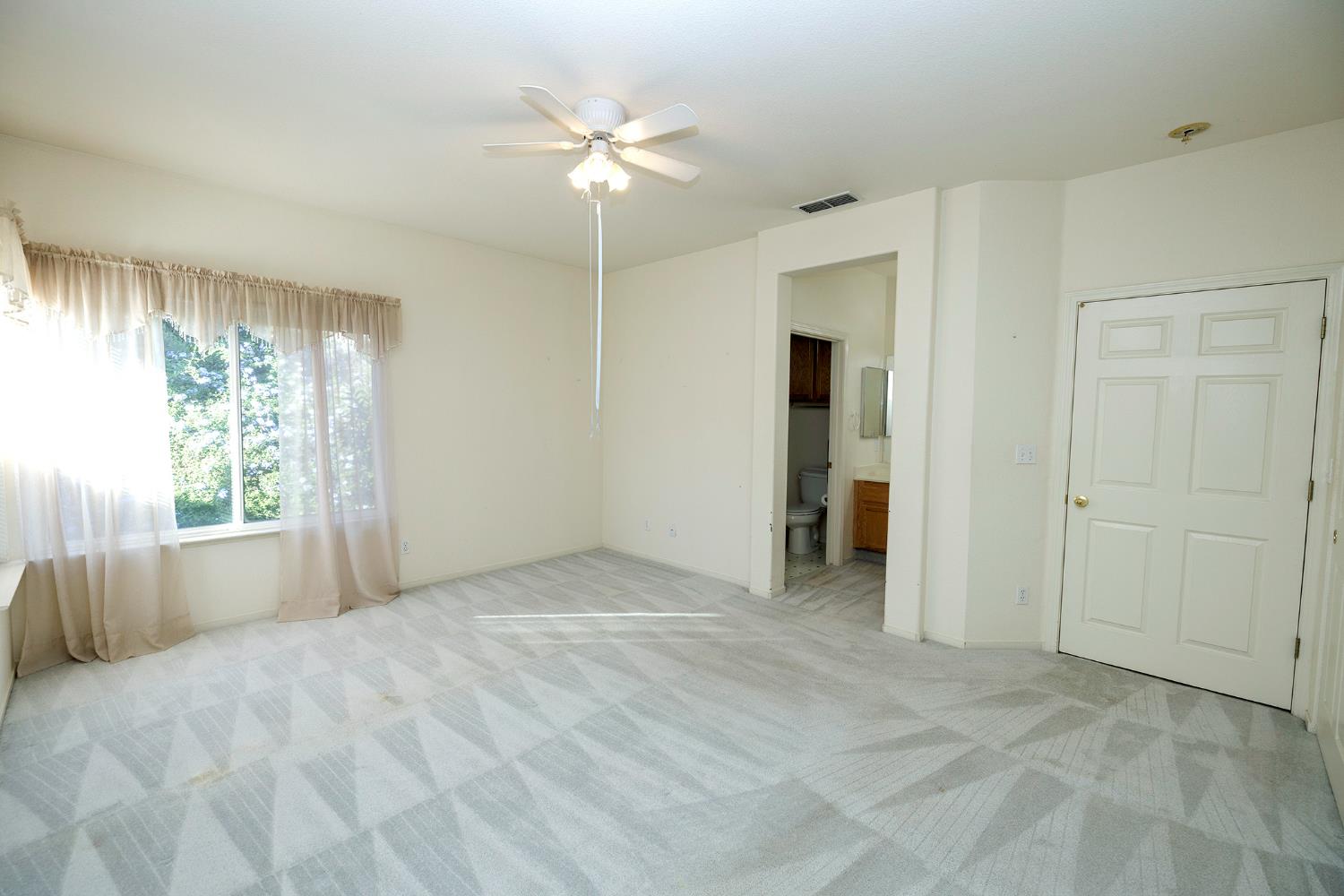 2123 Spring Blossom Lane Turlock, CA 95382 - Photo 14 of 44 a view of an empty room with a window